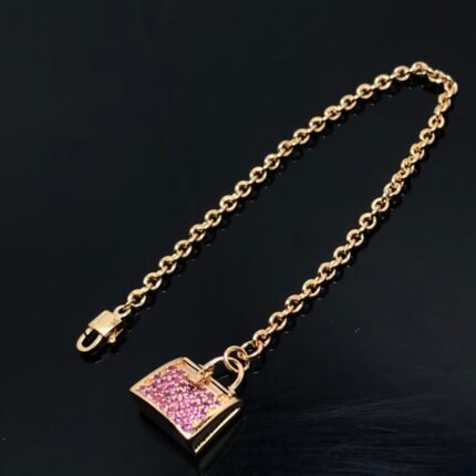 Hermes bracelet, H kelly bag with pink diamonds